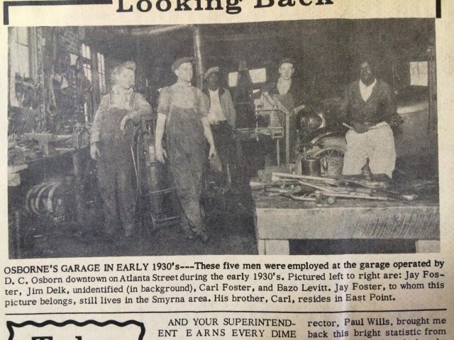 9. Osborne's Garage, interior view with workers, SH 11-15-62, p. 7-b