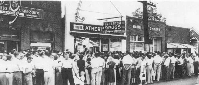 Crowd in front of Atherton Drug